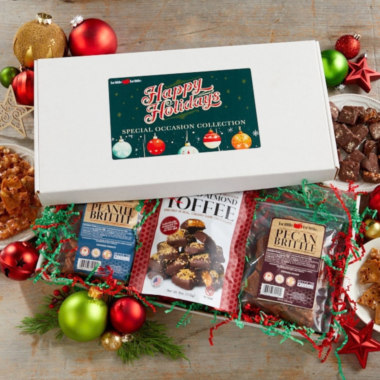 Texas Holiday Trio gift box open with peanut brittle, pecan brittle and almond toffee