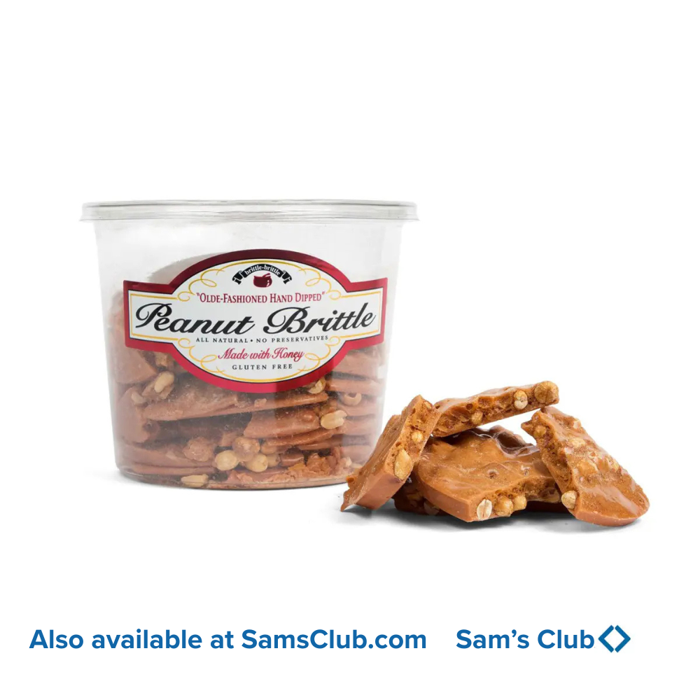 Peanut brittle in a container with a label, displayed on a white background.