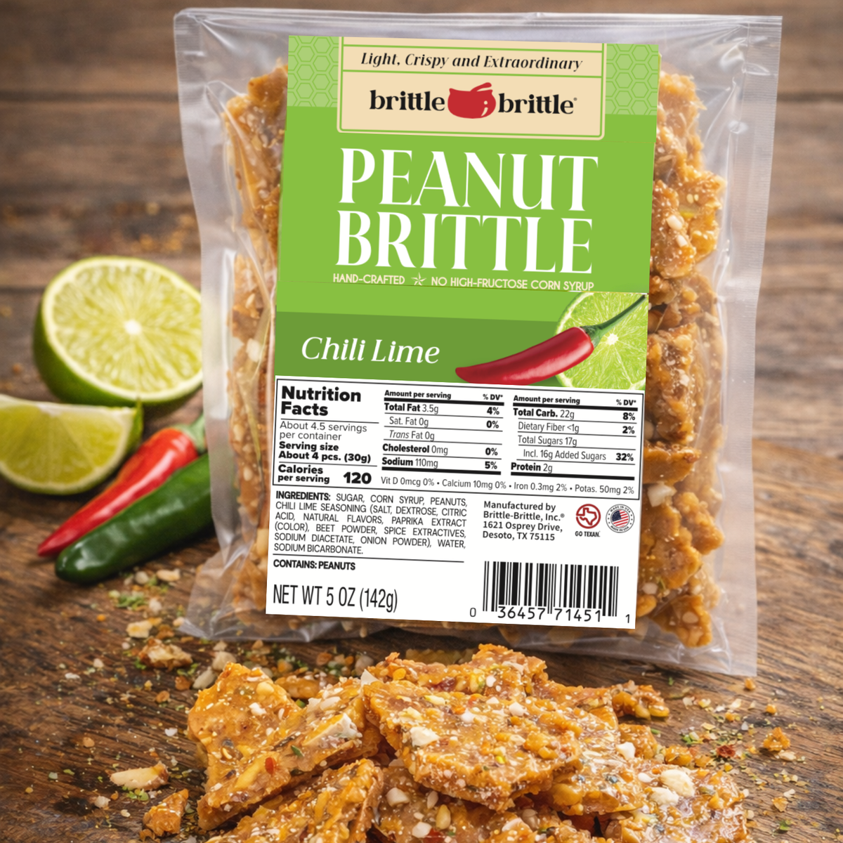 Packaged peanut brittle with Chili Lime flavor on a wooden surface with limes and a chili pepper.