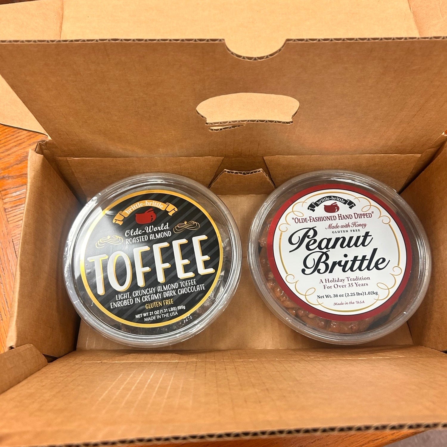 Two tubs of Brittle-Brittle® Toffee and Peanut Britlte
